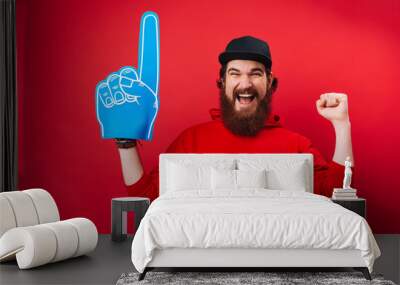 Nr. 1 Fan. A bearded guy with big blue glove, supporting his favorite team Wall mural