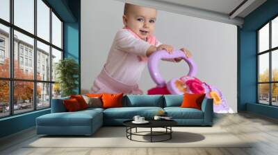 Happy baby girl excited to walk Wall mural