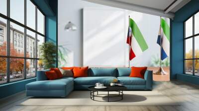 FLAGS OF EQUATORIAL GUINEA AND SIERRA LEONE ON TABLE Wall mural