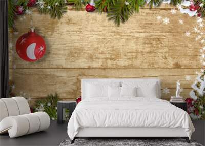 Christmas background with a border of fir branches, ball and hol Wall mural