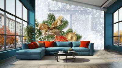 Christmas decorations on snowy window. Greeting card Wall mural