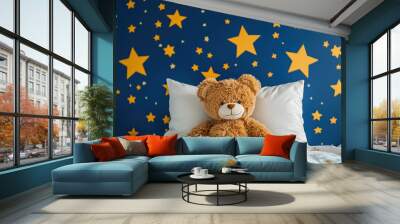 cute teddy bear toy lying on a bed with a white pillow and a blue wall decorated with yellow stars  Wall mural