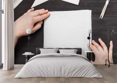 hands hold blank piece of paper on table Wall mural