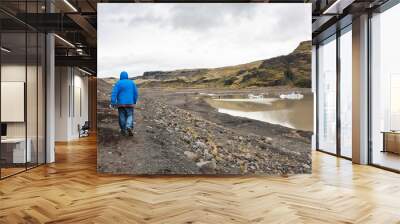 tourists hike on path from Solheimajokull glacier Wall mural