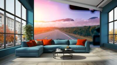 Road to the mountains at sunset. View from the windscreen. Beautiful nature of Norway Wall mural