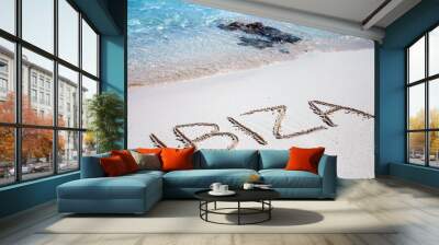 The inscription of Ibiza on the beach of white sand Wall mural