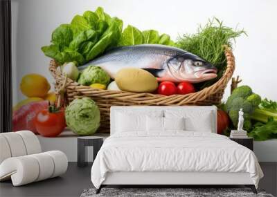 A health-conscious arrangement of fresh produce, fish, and pasta in a shopping basket on a white background, illustrating supermarket shopping and food delivery. Copy space image. Wall mural