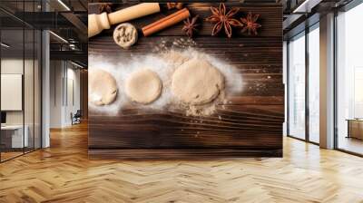 An assortment of delicious doughnuts surrounded by various aromatic spices on a rustic wooden table Wall mural