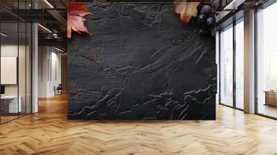 Autumn backdrop Grape leaves on a damp black wooden surface Copyspace Top view Wall mural