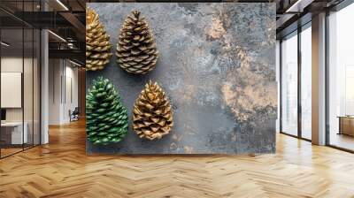 Flat lay featuring Christmas decorations Vivid green and gold decorative cones on a grey textured backdrop Space for text Still life. with copy space image. Place for adding text or design Wall mural