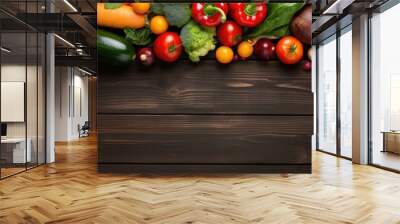 Fresh fruits and vegetables arranged on a wooden background promoting a healthy food concept from a top down perspective with room for text Wall mural