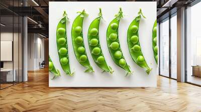 Fresh organic raw green pea pods opened on a white background Healthy eating vegan and vegetarian legume food raw food and detox superfood bean protein close up. with copy space image Wall mural