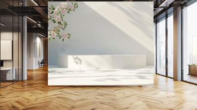 Geometric empty podium plaster platform for product display accompanied by spring flowers and shadows on a white background. with copy space image. Place for adding text or design Wall mural