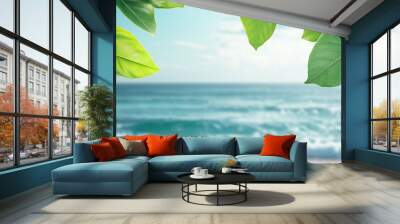 Green leaves against a backdrop of the sea Front view. with copy space image. Place for adding text or design Wall mural