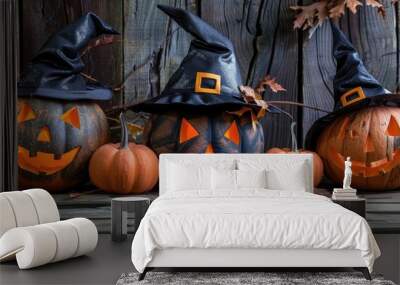 Halloween holiday theme featuring two large ghost pumpkins wearing black hats on a wooden background. with copy space image. Place for adding text or design Wall mural