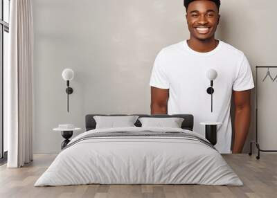 Handsome young African American student with black denim pants and blank white T shirt for text or advertising Wall mural