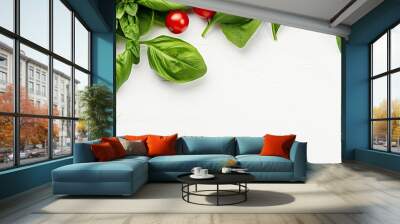 High quality photo featuring a flat lay of ripe red cherry tomatoes and fresh green spinach leaves on a white background, emphasizing a concept of healthy eating with copy space image. Wall mural