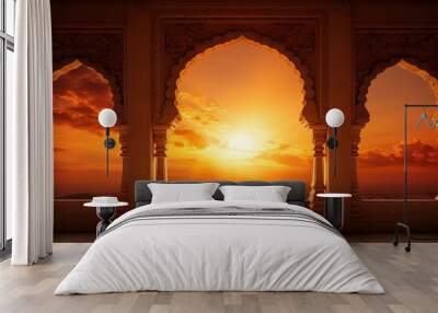 Indian temple silhouette at striking sunset sky Empty space for text Wall mural