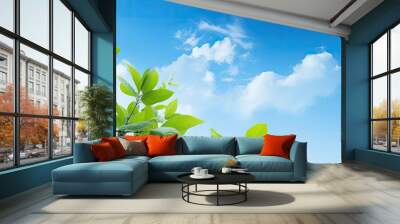 Lush foliage set against a vibrant blue sky in a summer setting with plenty of copy space image available to use. Wall mural