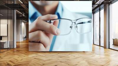 Male eye doctor wearing glasses in clinic close up Text space Wall mural