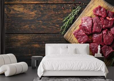 Sliced raw venison deer meat for a stew on a butcher s cutting board Wooden background Top view. with copy space image. Place for adding text or design Wall mural