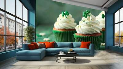 St Patrick s Day cupcakes with clover leaf decorations and cream on a green wooden background close up view with copy space image Wall mural