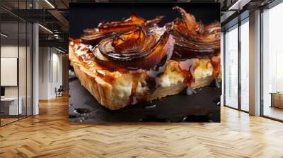 Sticky and savory caramelized onion tart served on a sleek black stone background. with copy space image. Place for adding text or design Wall mural