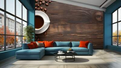 Various items on wooden surface above hot coffee from above Wall mural