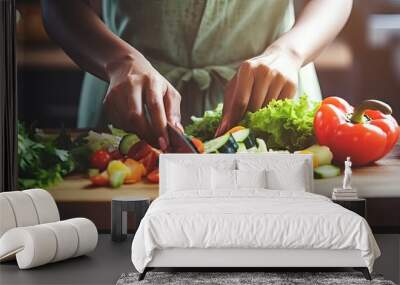 Young black woman cooking with organic food in kitchen closeup copy space available cutting fresh vegetables Wall mural