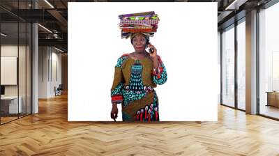 beautiful woman with traditional loincloth on her head talking on mobile phone smiling. Wall mural