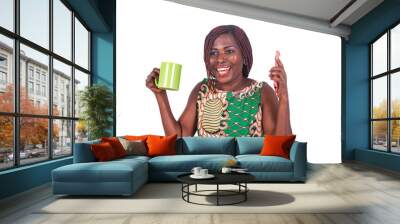 happy adult woman holding a cup of coffee with a mobile phone smiling. Wall mural