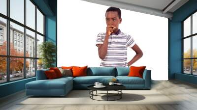 Teenage boy thinking with hand over mouth. Wall mural