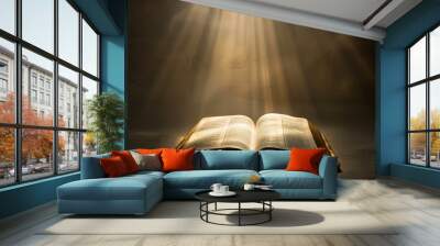 A book is open to a page with a sun shining on it. The sun is casting a warm glow on the pages of the book Wall mural