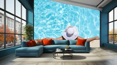 beautiful young woman in the swimming pool on a sunny summer day Wall mural