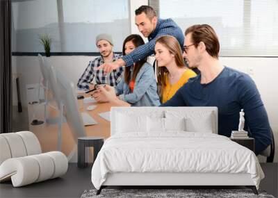 group of five young people student with their teacher in photography school learning photo editing with desktop computer, camera and photo equipment Wall mural