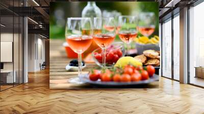 holiday summer brunch party table outdoor in a house backyard with appetizer, glass of rosé wine, fresh drink and organic vegetables Wall mural