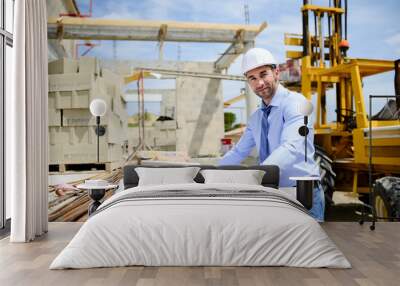 portrait of handsome young man architect on a building industry construction site Wall mural