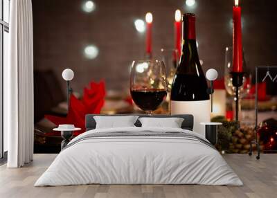 red wine bottle on a christmas holiday festive party table with wine a glass on red and gold shiny d Wall mural