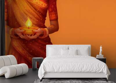 indian woman in traditional kerala attair holding a traditional bowl. Orange background with inscription for text. Religious template Wall mural