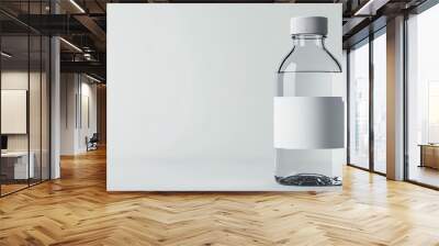 A clean and simple water bottle with a blank label, perfect for branding or minimalistic designs in various creative projects. Wall mural