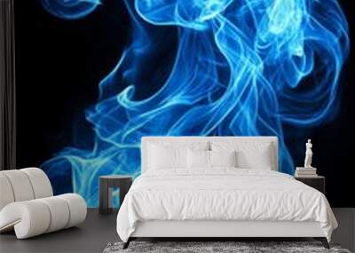 A mesmerizing swirl of blue smoke rises against a dark background, creating an ethereal and tranquil atmosphere. Wall mural