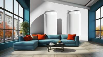 Two blank white cans positioned on a minimalist surface, showcasing a modern and clean design with soft shadows. Wall mural