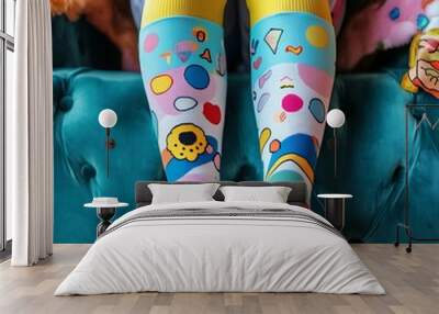 Quirky knee-high socks with bright patterns, close-up of legs, fun National Sock Day  Wall mural