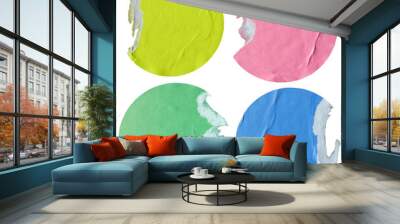 Round yellow, pink, green and blue paper stickers with torn edge Wall mural