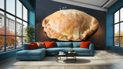 Baked pasty hot out of the oven on a baking tray Wall mural