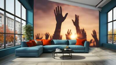 group people hands rising background at sunset light  Wall mural