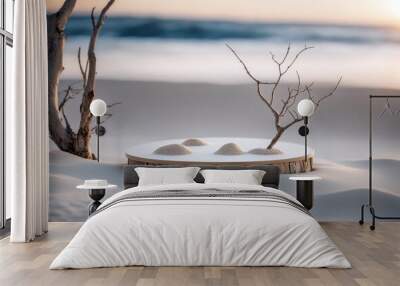 Two empty round beige platform podiums and dry tree twigs on white beach sand background Wall mural