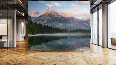 This stunning image captures the beauty of Almsee Lake in Austria. The calm waters reflect the surrounding mountain peaks, creating a breathtaking scene.  Wall mural