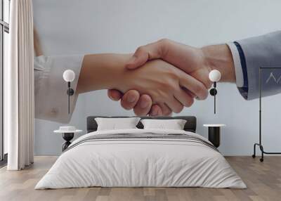 Close-up of a handshake isolated on a white background. A business person and a woman shaking hands in a successful deal Wall mural