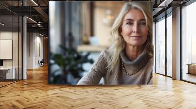 Capture the presence of a middle-aged female psychotherapist and counselor as she sits alone in her office, looking directly at the camera.   Wall mural